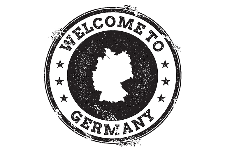 Schwarz-weißer Stempel im Grunge-Look mit der Silhouette Deutschlands in der Mitte und dem Text „WELCOME TO GERMANY“, umgeben von Sternen.